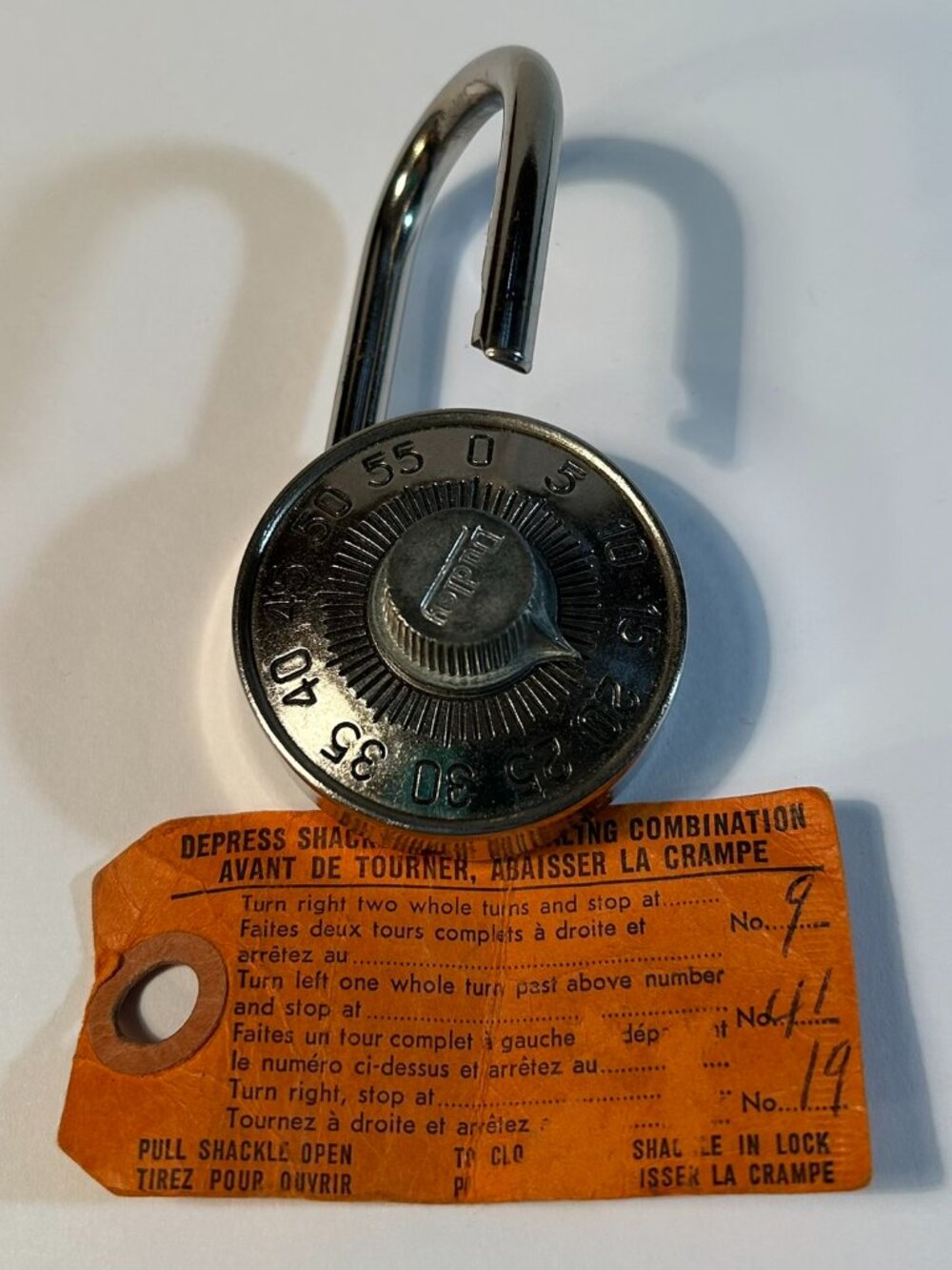 Vintage Dudley combination lock with original code tag
